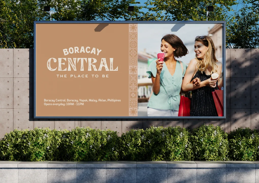 Boracay Central billboard: The Place to Be, with two shoppers enjoying ice cream
