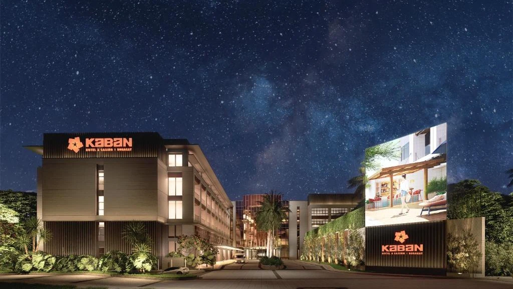 Kaban Hotel & Casino at night under a starry sky, its orange star logo lit on the facade