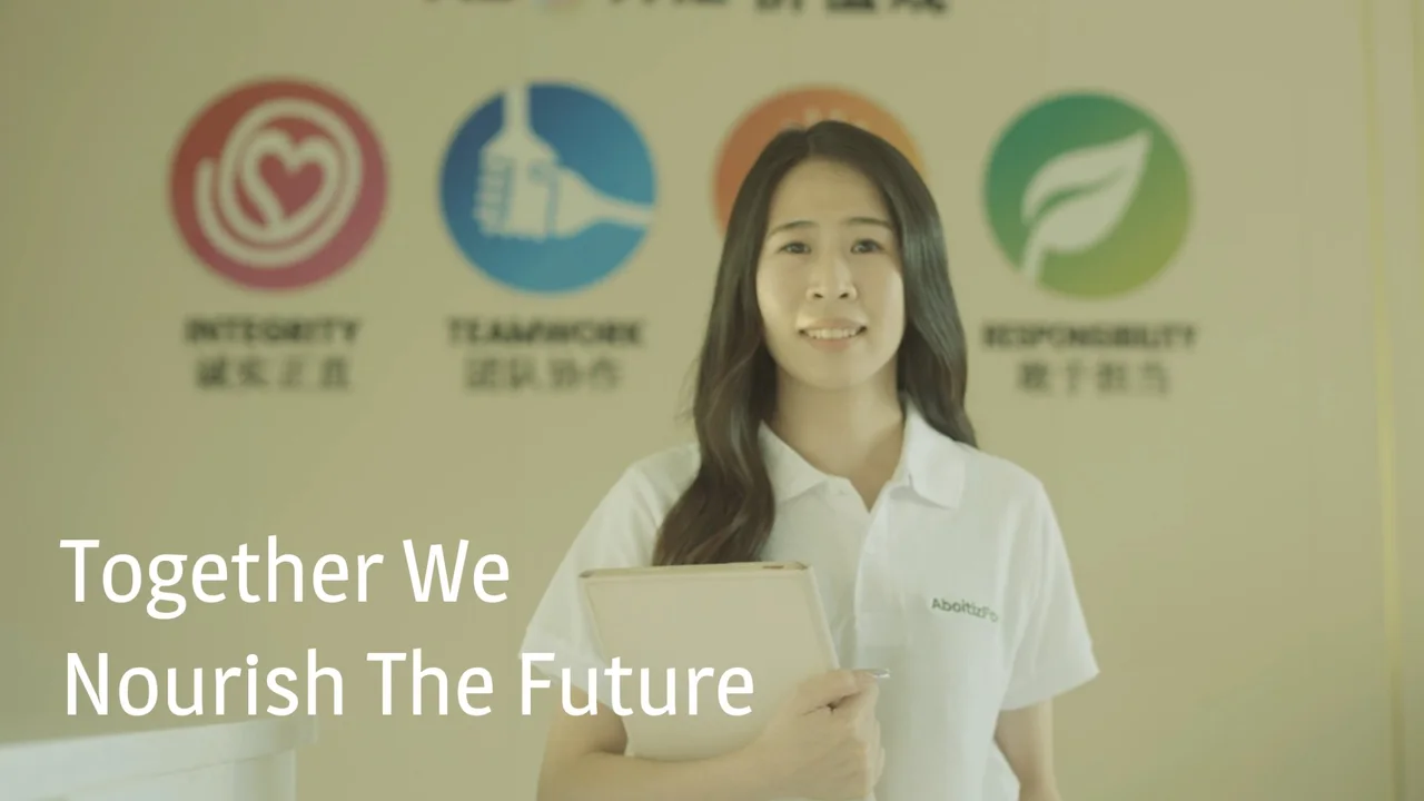 Aboitiz Foods homepage hero: Together We Nourish The Future, with an employee in front of the group's values